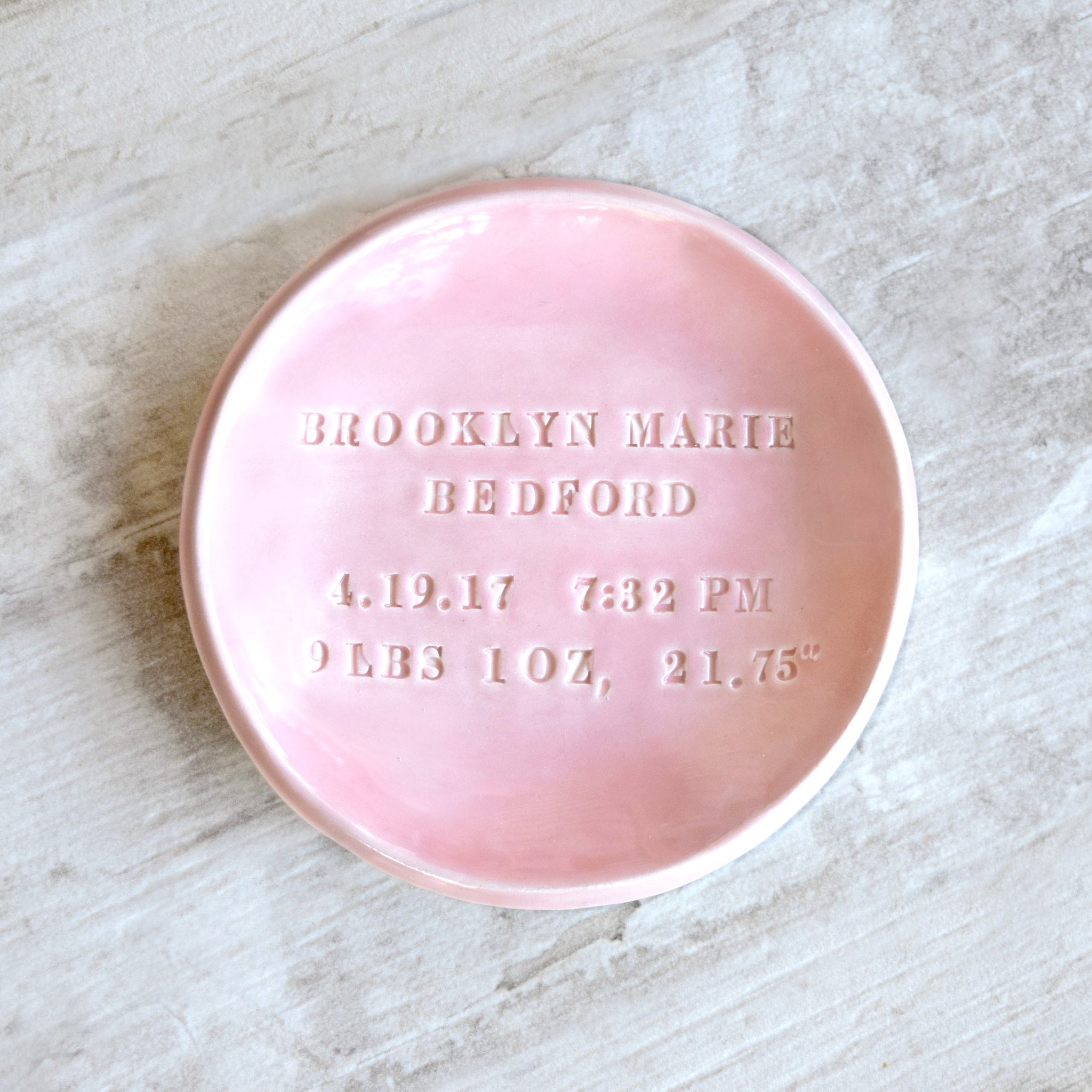 Handmade Pink ceramic dish with hand stamped text on a marble surface. classic pottery clay bowl baby bowl, birthday keepsake newborn name date time weight length, day you were born dish for new parents gift 