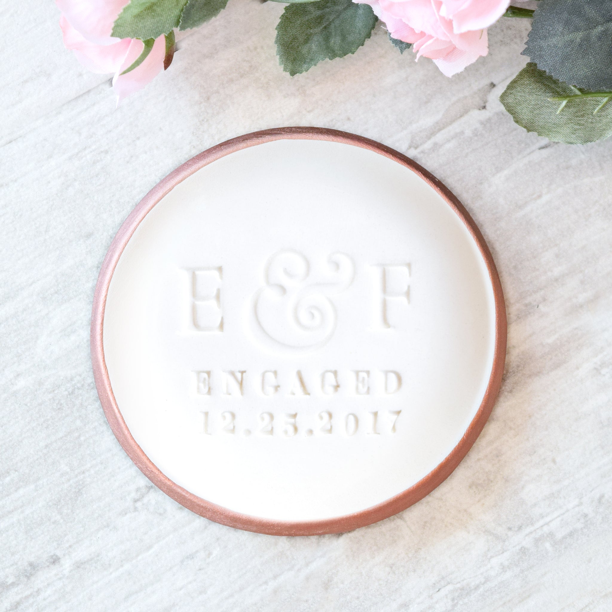 custom engagement ring dish personalized pottery engaged couple gift, classic rose gold rim white gloss ceramic bowl, hand engraved couples 2 name initial letters, word engaged and date future daughter in law proposal gift